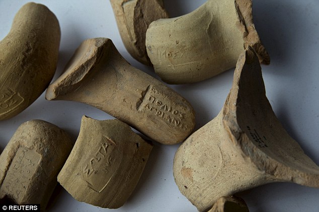 The remains of wine jugs and handles (pictured) were also discovered on the site of the ruins. They carry marks that indicate they were imported from the Aegean region of Greece.